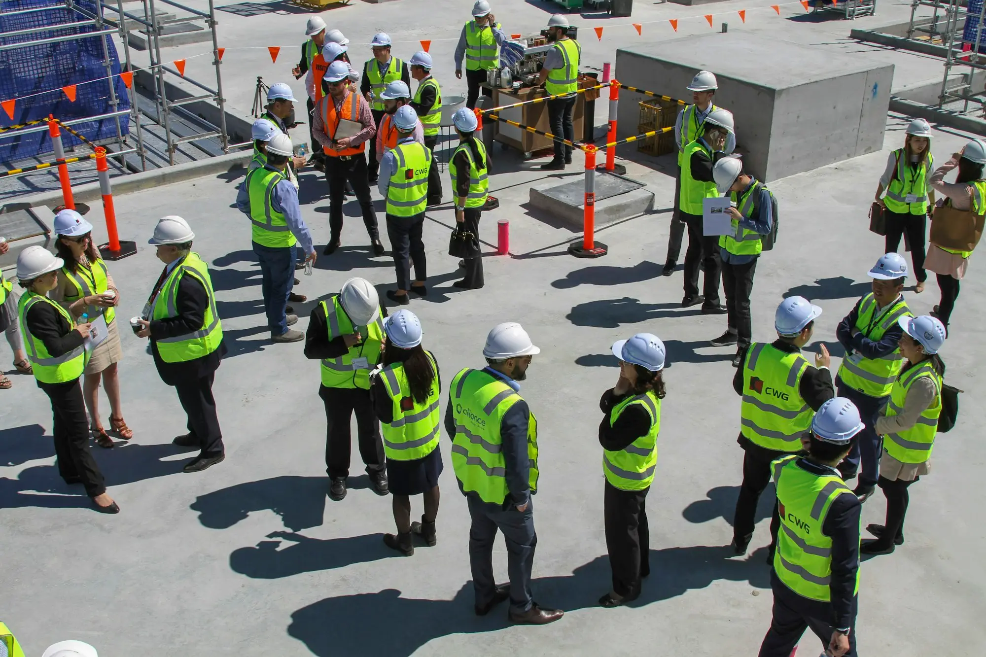 Construction and factory crew in hi-vis at a site briefing in Melbourne